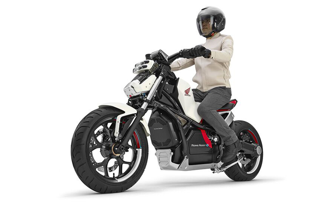 Image of a man riding the Honda RideAssist self-balancing motorcycle.